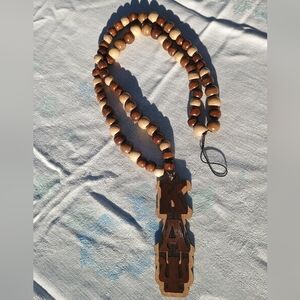 Kappa Alpha Psi Wooden Beaded Necklace with Carved Pendant.